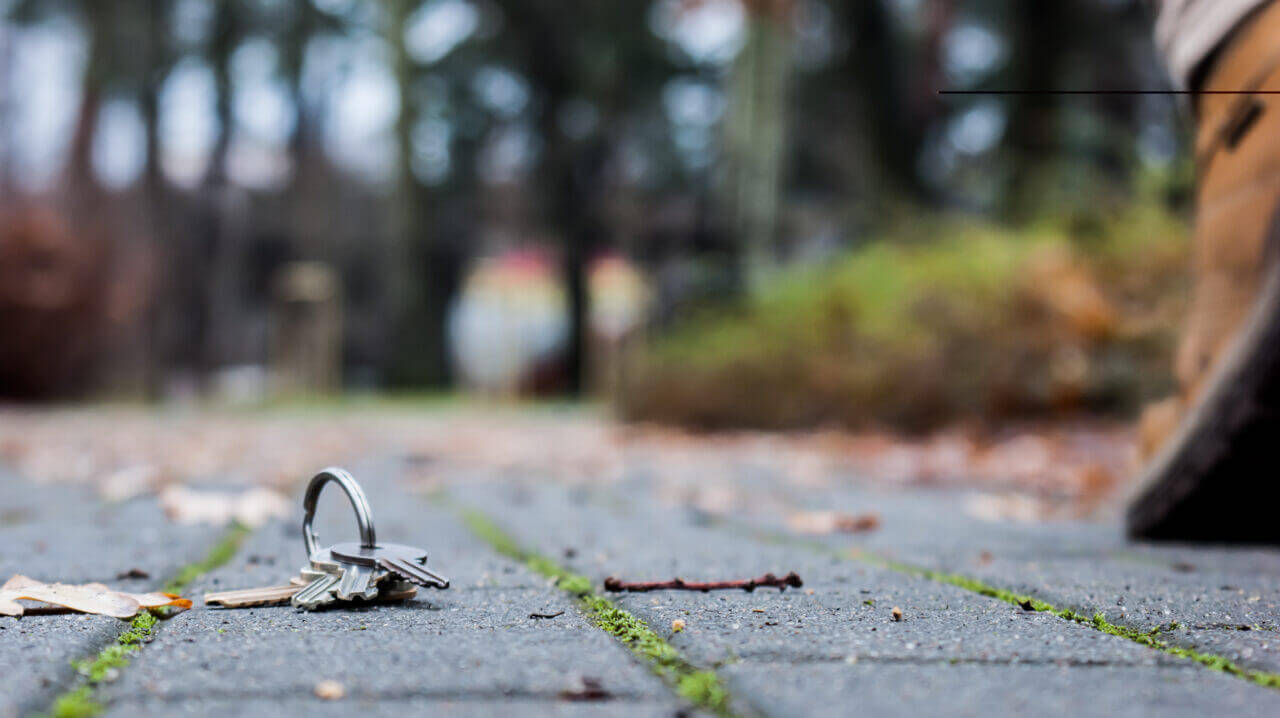 Close up of keys dropped on ground in an outside area