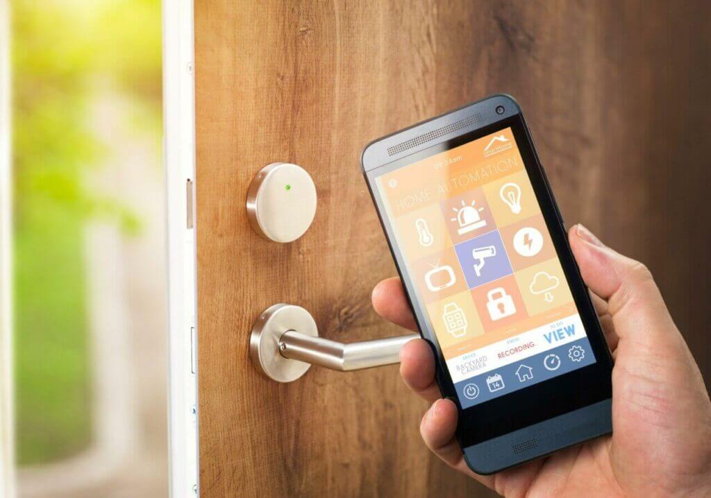 A Person Unlocking The Door With A Smart Home App 1024x718