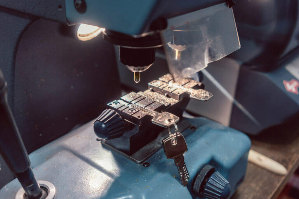 Key duplicator machine being used to duplicate a key