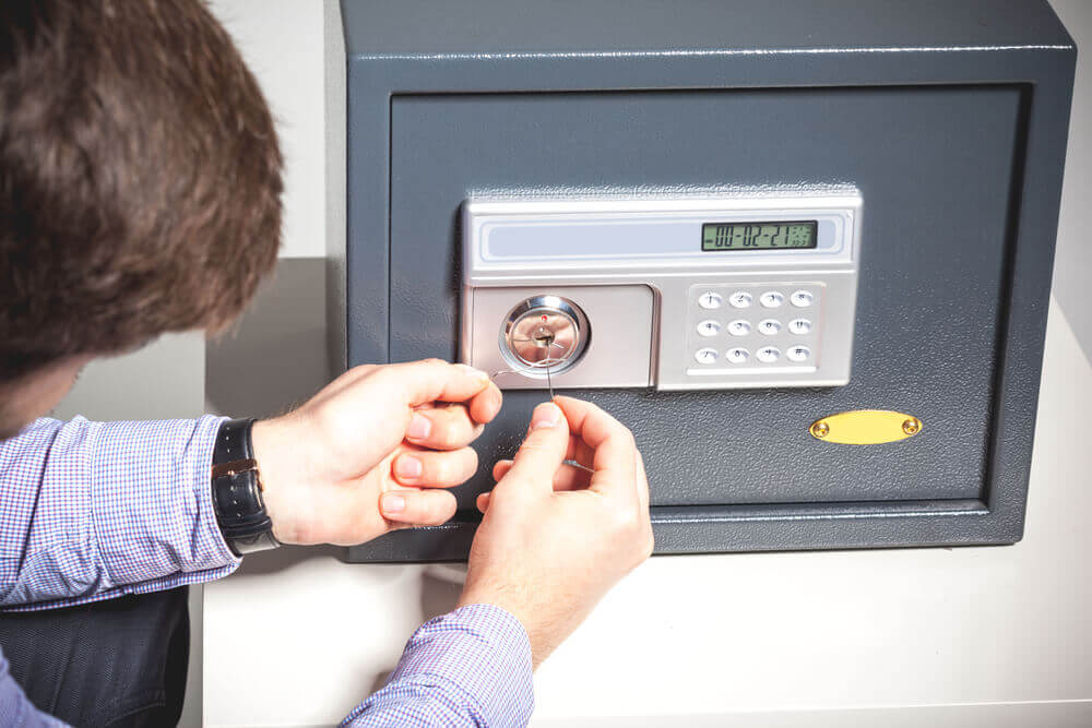 Person Picking A Safe Lock